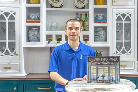 man standing in front of cabinetry
